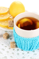 Fototapete - Cup of tea with lemon close up