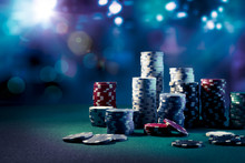 Casino Chips With Dramatic Lighting And Lens Flares