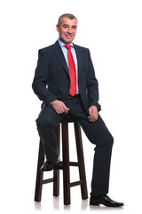 Wall Mural - business man on high stool