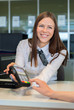 © tivoly - Bank worker offer to pay by credit card in bank