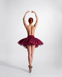 © Acronym - Young naked redhead female ballet dancer in a studio