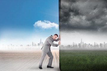 Poster - Composite image of businessman pushing away scene