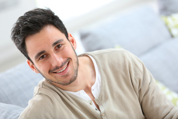 Wall Mural - Portrait of young man relaxing at home