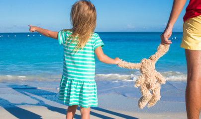 Poster - Little adorable girl play with her bunny toy