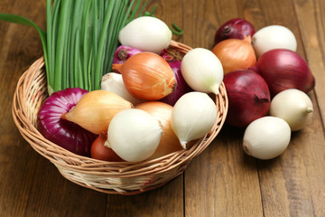 Wall Mural - Different raw onion on wooden background