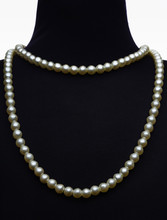 Necklace Type Pearl On Black Mannequin Isolated On White