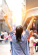 © lzf - cheering woman open arms at street