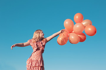 happy little girl  outdoors with balloons