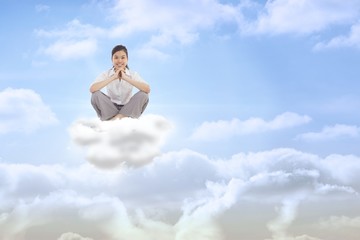 Poster - Composite image of businesswoman sitting cross legged with hands