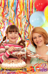 Wall Mural - happy mother and daughter eat birthday cake