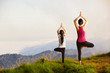 © Patrick Foto - Mother and daughter doing yoga