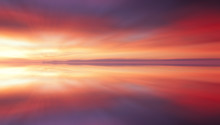 Reflection Of Colorful Sunset Clouds With Long Exposure Effect