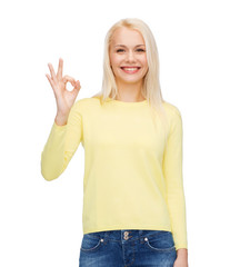 Poster - young businesswoman showing ok sign