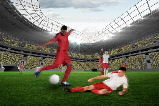 Football player in red kicking