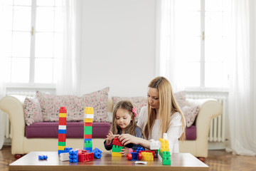 Canvas Print - Mother and daughter playing in the room