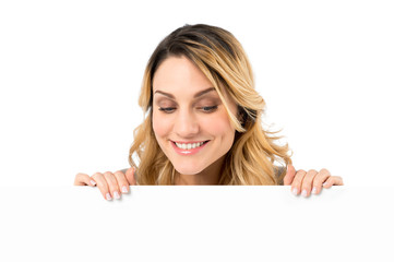 excited woman holding blank sign