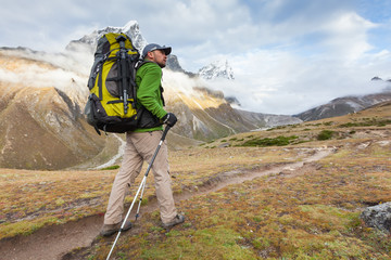 Wall Mural - hiker walks on train in himalayas
