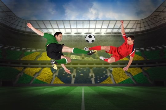 Football players tackling for the ball