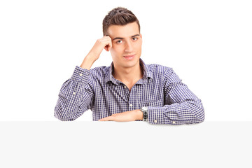 Canvas Print - Man posing behind a blank panel