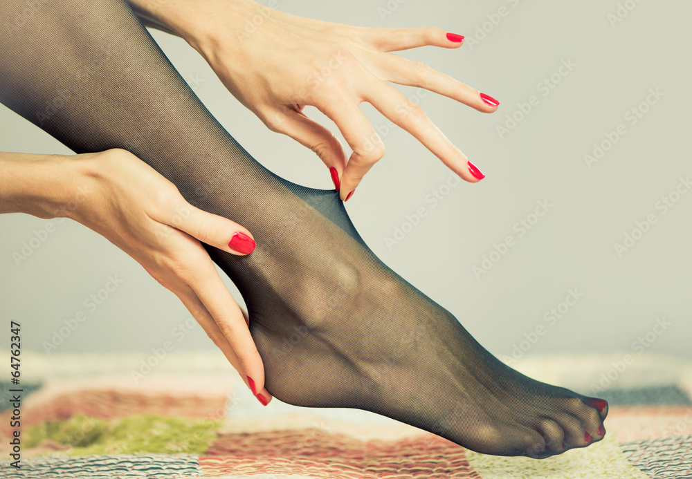 sexy nylon on a female leg - obrazy, fototapety, plakaty 