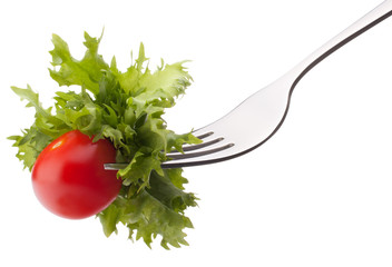 Fresh salad and cherry tomato on fork isolated on white backgrou