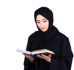 Wall Mural - Beautiful muslim arabic woman reading book on grey background