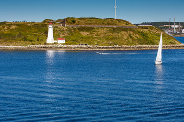 Sticker - White Sailboat Approaching White Lighthouse