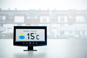 Wall Mural - Weather station device with weather conditions outside backgroun