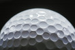 © shefkate - A close-up of a golf ball over dark background