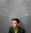 © ra2 studio - Thoughtful businessman with charts above his head