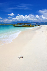 Beach on Gili Trawangan island with yellow boats