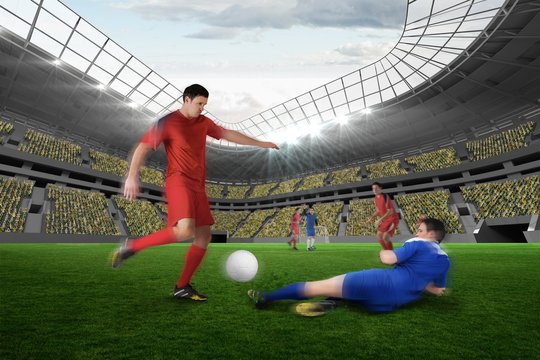 Football player in red kicking