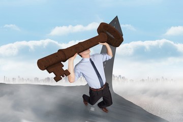 Poster - Composite image of businessman carrying large key