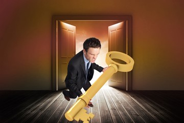 Aufkleber - Composite image of businessman carrying large key