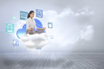 Poster - Composite image of businesswoman sitting in lotus pose