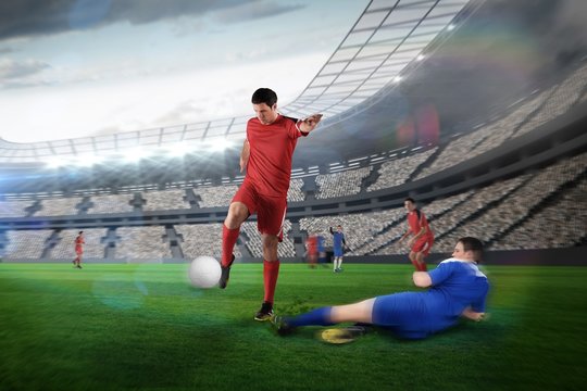Football player in red kicking