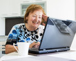 Elder woman with a computer