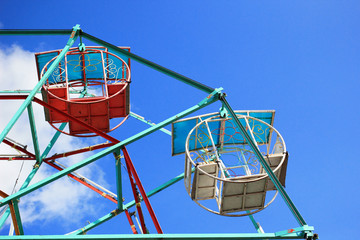 Part of colorful ferris wheel with blue sky in Thailand.