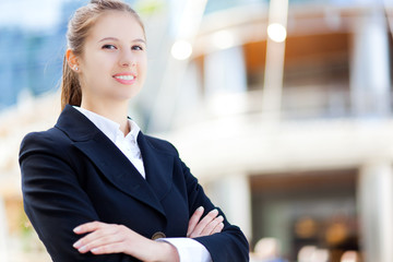 Wall Mural - Smiling businesswoman outdoor