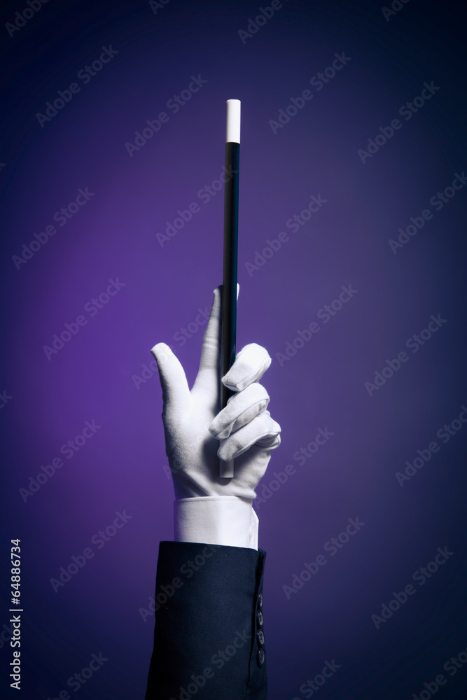 High contrast image of magician hand with magic wand Stock Photo ...