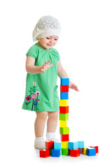 Fototapete - kid playing toy blocks  isolated on white background