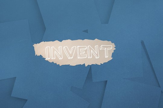 Invent against digitally generated blue paper strewn