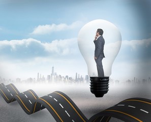 Poster - Composite image of thinking businessman in light bulb
