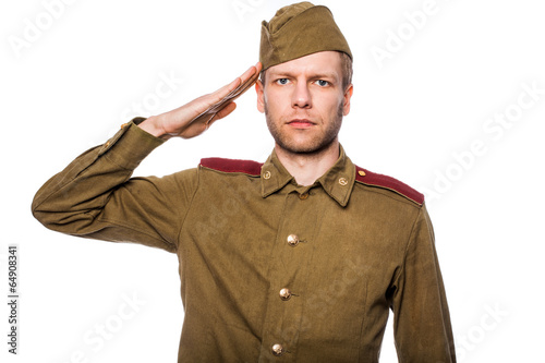 Фото военный отдает честь Russian soldier saluting. Studio portrait isolated фотография Stock Adobe Stock