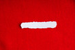 scrap paper blank copy space on red fabric textile material
