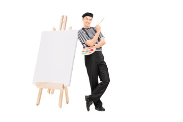 Sticker - Male artist leaning on easel and holding a paintbrush