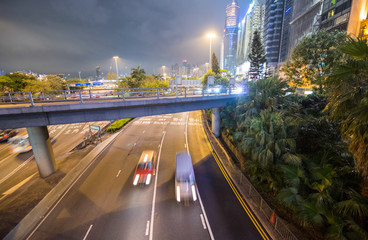 Wall Mural - Hong Kong city traffic at night in the middle of tall skyscraper