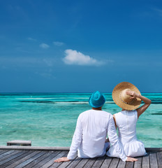 Sticker - Couple on a beach jetty at Maldives