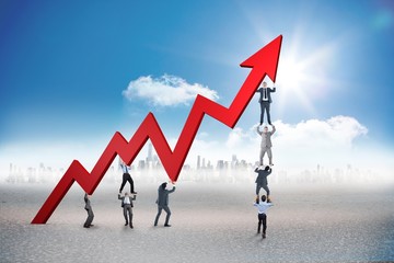Poster - Composite image of business team holding up arrow