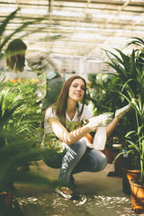 Canvas Print - Young women in the flower garden